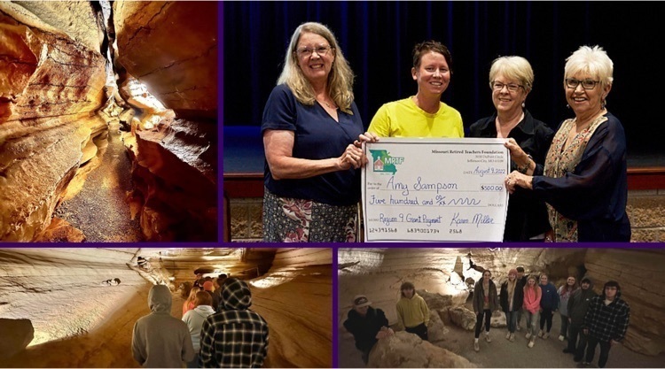 Four females holding a big cardboard check, a cave, students in a cave