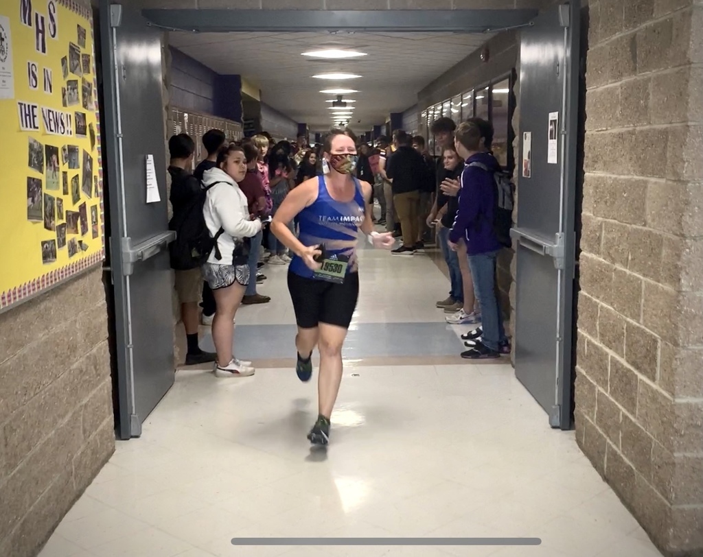 Ms. Sampson running in the send off tunnel before the Boston Marathon.