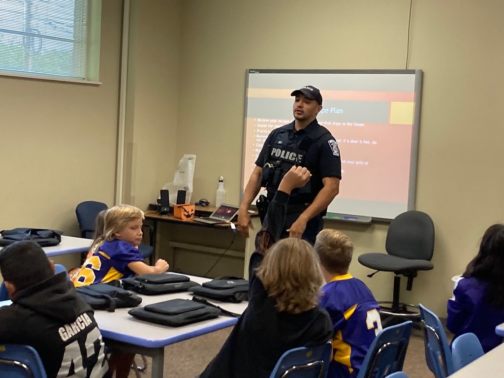 Officer Rice in class teaching students. 