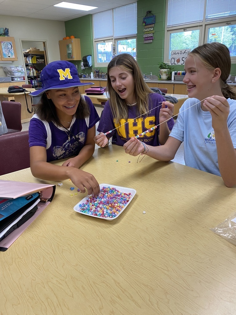 Students in Yearbook are creating goal bracelets. Each bead represents a goal.