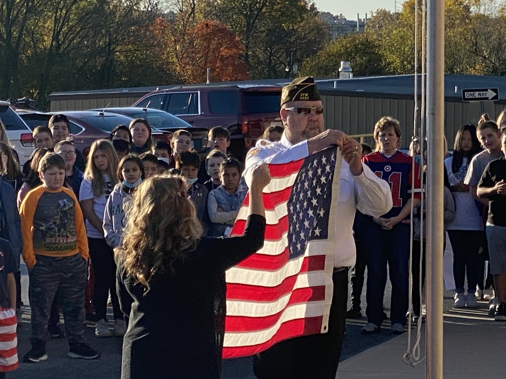 MIS Honoring Veterans at the flag pole
