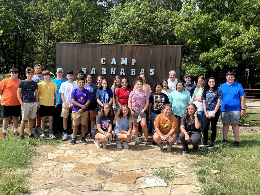 GO CAPS students in front of the Camp Barnabas sign. 