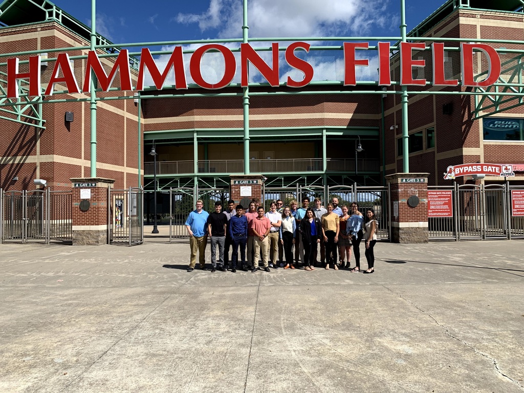 Group photo in front of the Hammons Field sign. 