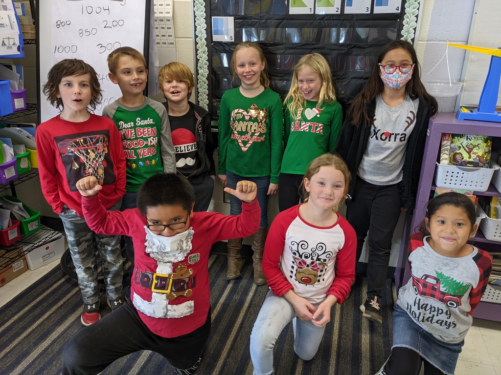 Students in class wearing holiday shirts. 