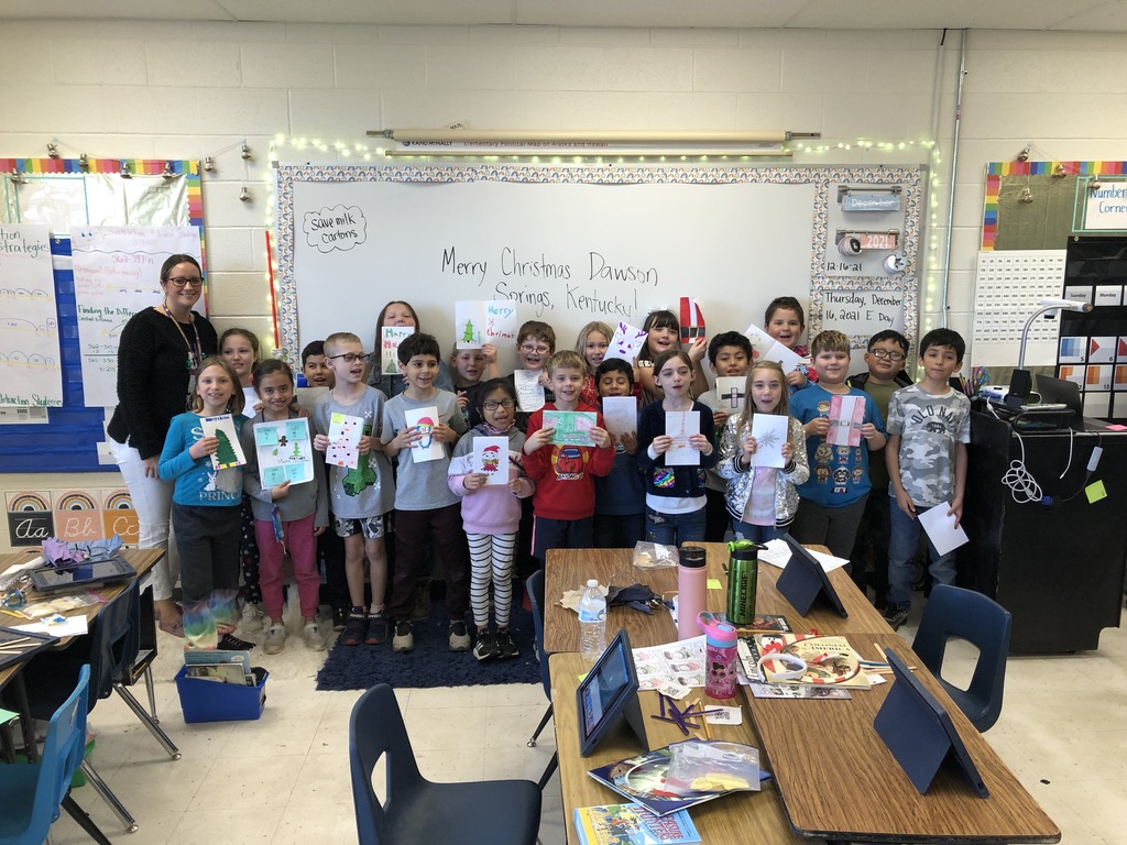 Students holding Christmas cards for Dawson Springs, KY. 