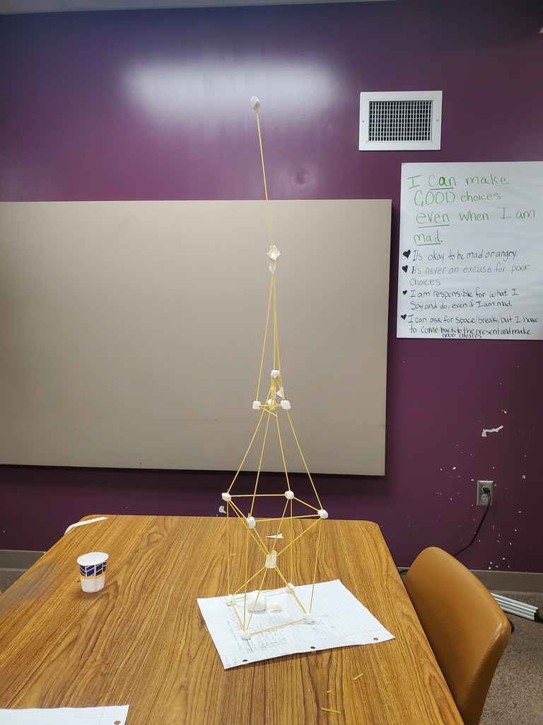 Tall marshmallow and spaghetti tower. 