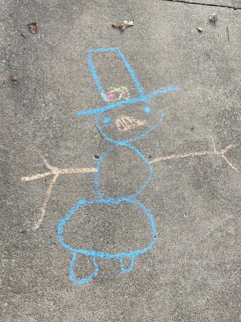 snowmen on concrete drawn with chalk 